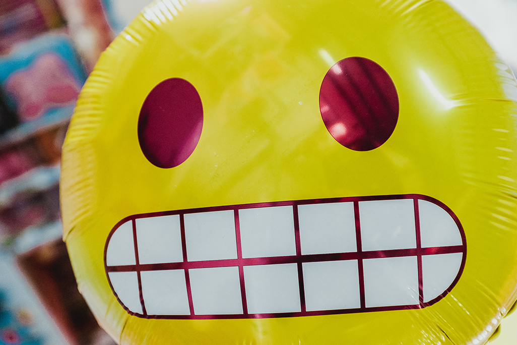 when to talk to kids about sex, Why Parents and Caregivers Are Afraid To Talk About Puberty and Sex With Their Kids and Teens, image of a emoji balloon with a grimace face.
