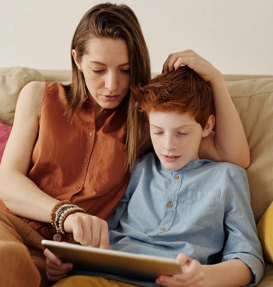 Talking With Pre-Teens and Teens About Sex, image of mom and son sitting on a tablet.