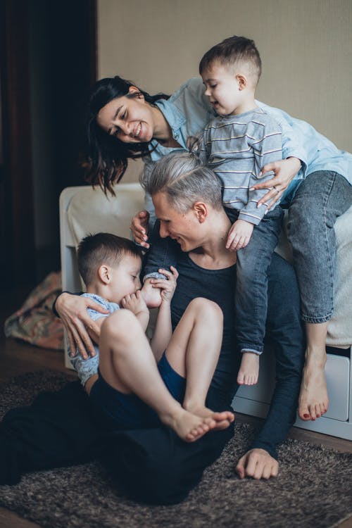 family therapy, image of family and boys bonding and laughing.